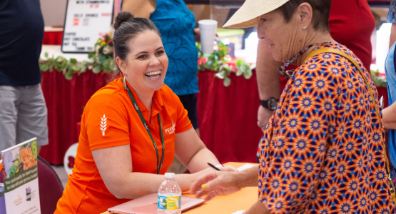 Feeding Tampa Bay staff helps client with SNAP