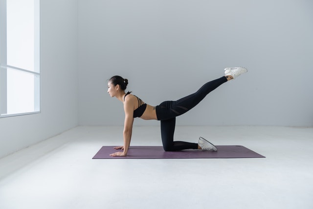 woman preforming yoga