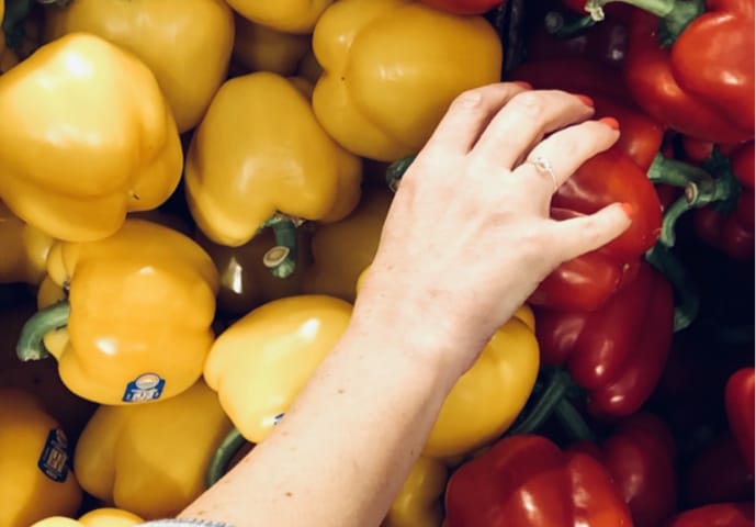 A volunteer picking peppers