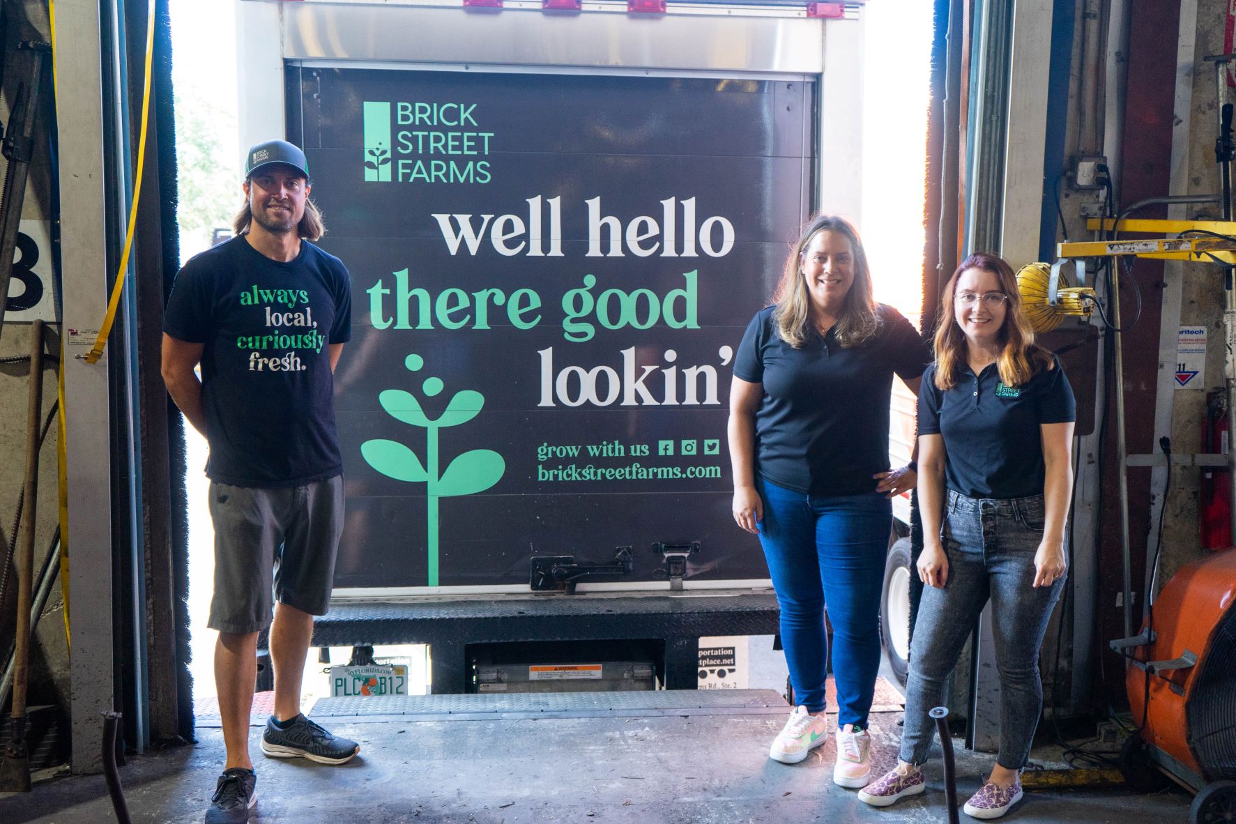 Brick Street Farms team standing by their truck at our warehouse