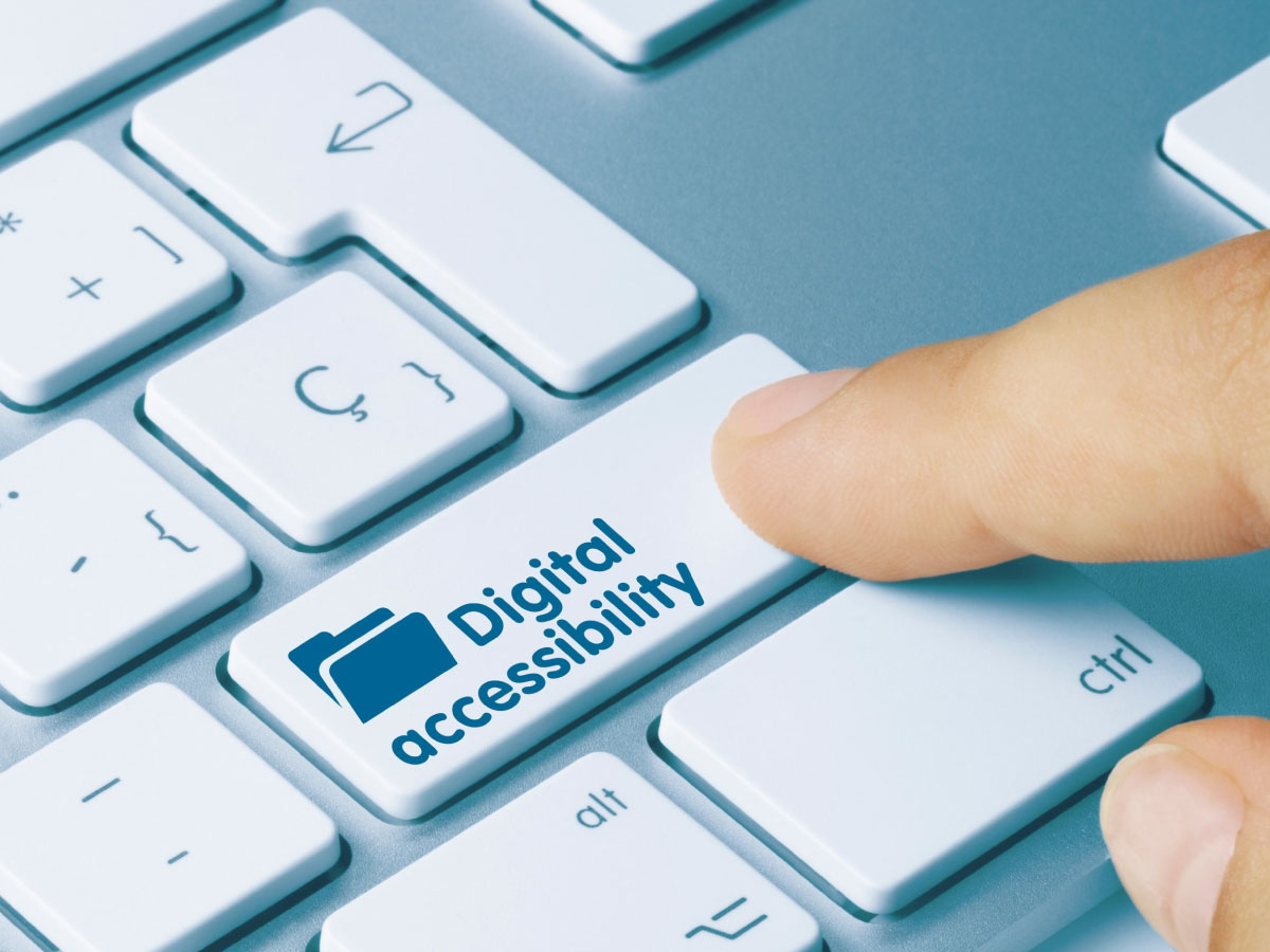 Generic image of someone pressing down a keyboard key that reads Digital Accessibility
