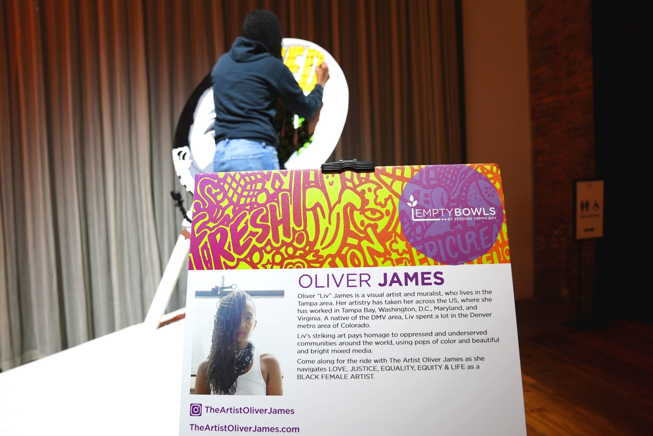Oliver James live-painting at Empty Bowls 2022