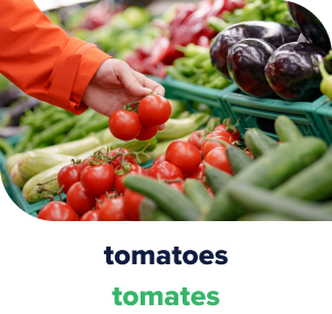 Hand reaching for tomatoes at the grocery store.